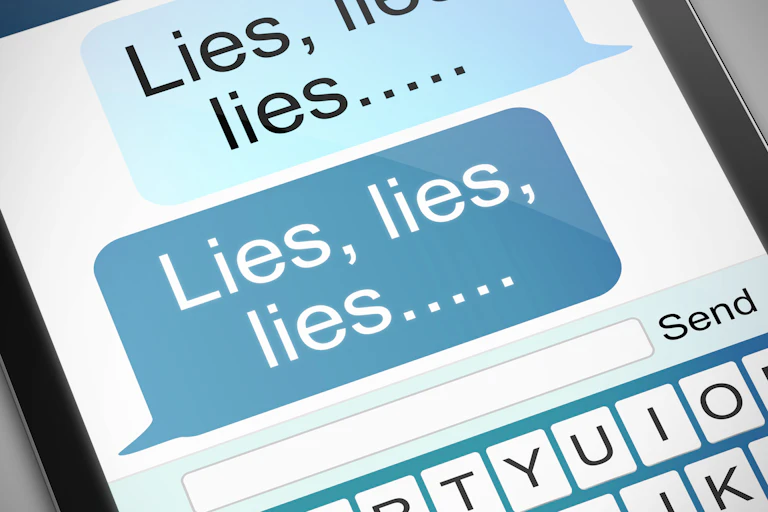 Smartphone screen with texts reading 'Lies, lies, lies...'