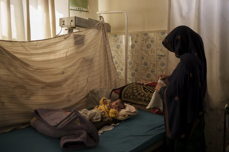 A baby in a hospital malnourished ward.