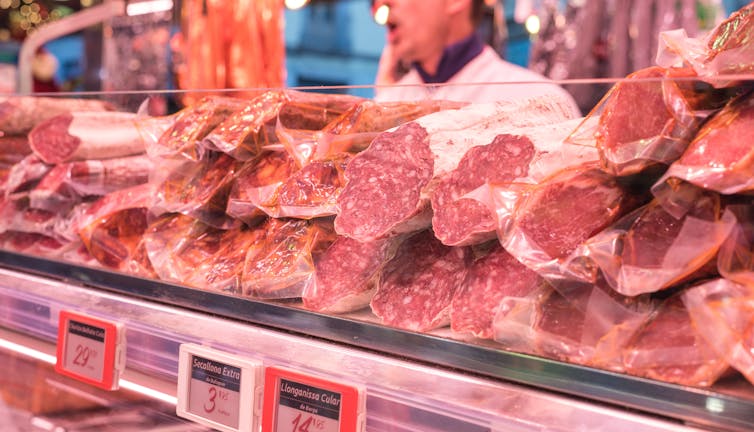 Meat on a shelf in a fridge