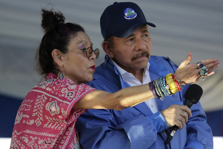 Nicaragua's vice president Rosario Murillo gesticulates to her husband Nicaraguan President Daniel Ortega.