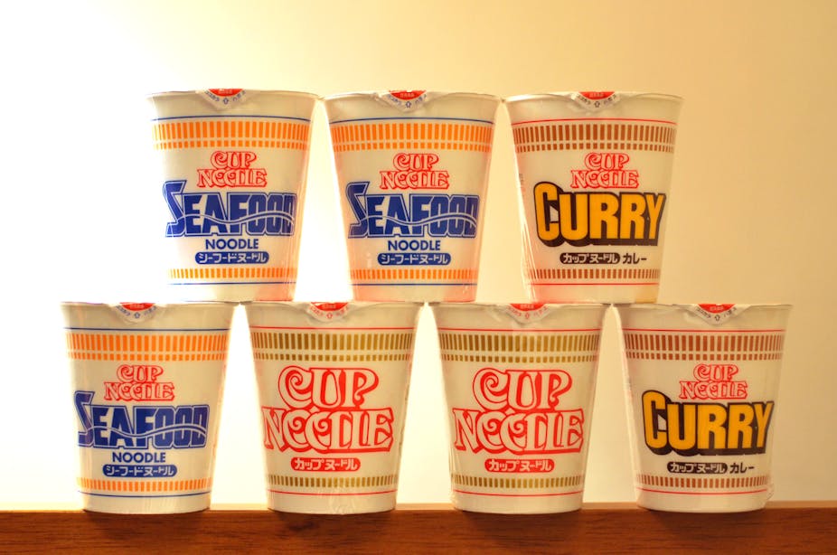 Different flavors of Cup Noodles stacked on one another.