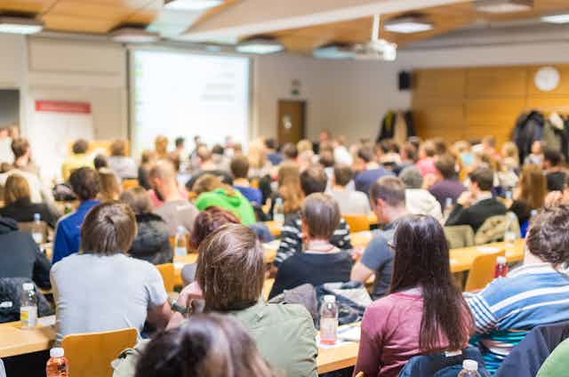 Large university class listens to lecture