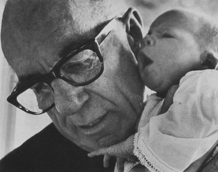 Child expert Benjamin Spock with his baby granddaughter.