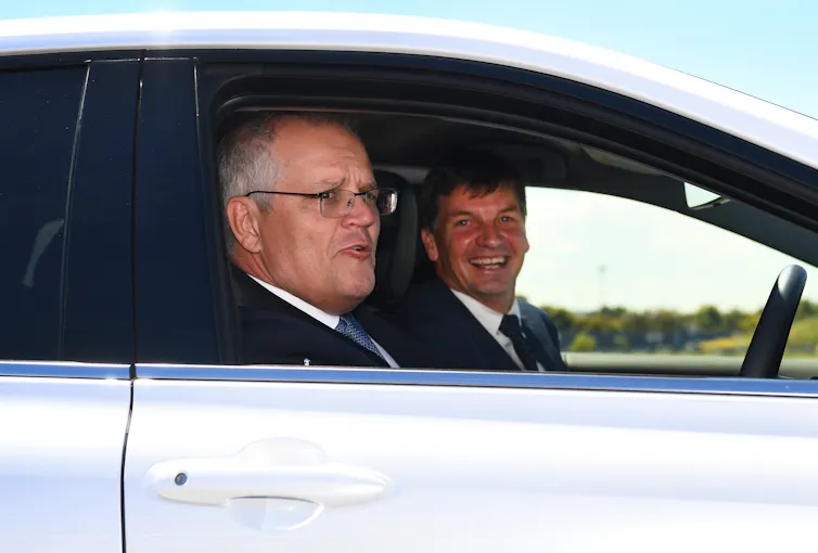 profile of two men in car
