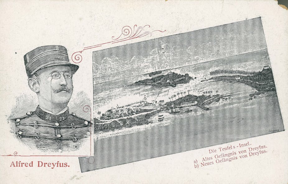An old, black and white postcard shows a drawing of a military officer and a remote island.