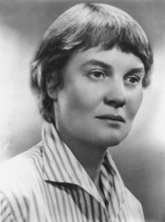 A headshot of Iris Murdoch in black and white