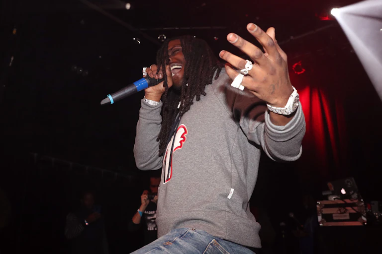Man rapping on stage.