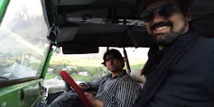 Two men in car.