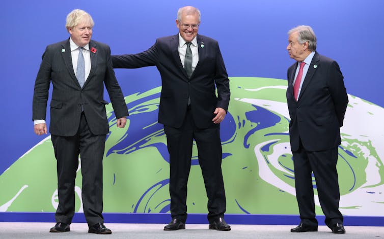 Boris Johnson, Antonio Guterres, Scott Morrison stand together at COP26