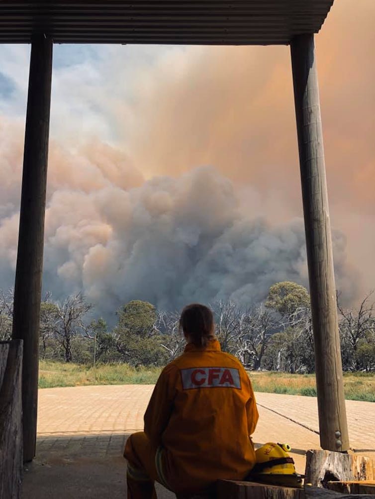 firefighter looks at smoke