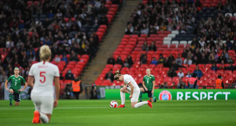 Players take the knee ahead of a Women's World Cup qualifier game between England and Northern Ireland at Wembley Stadium, London, October 2021.