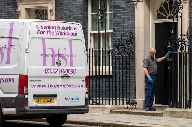 A van for a cleaning company parked outside 10 Downing Street.