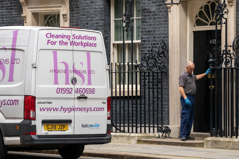 A van for a cleaning company parked outside 10 Downing Street.