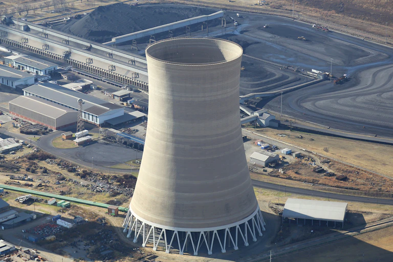 Tower surrounded by land and coal