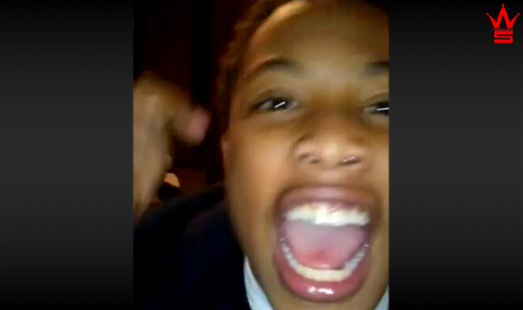 Boy yelling into camera.