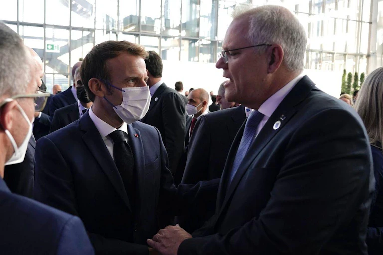 Scott Morrison greets Emmanuel Macron at the G20.