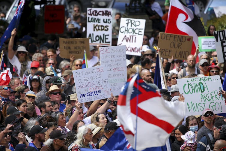 Anti-lockdown and vaccine mandate protesters with signs and placards