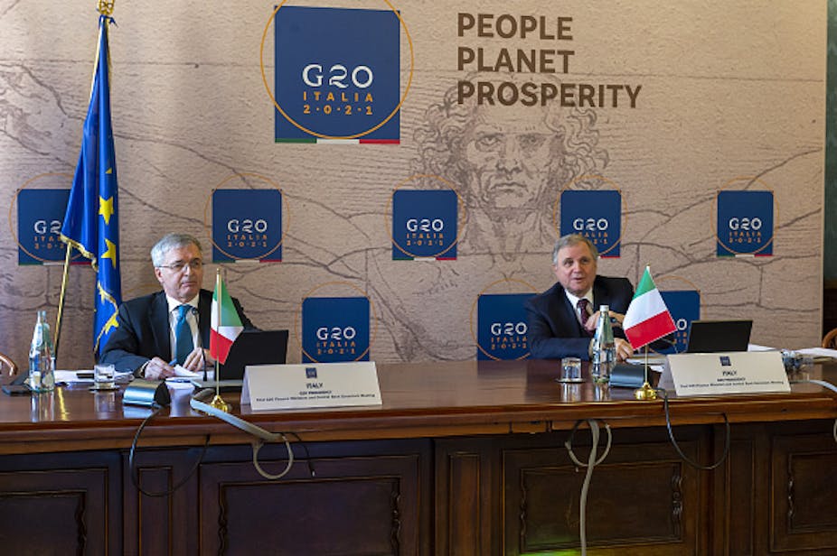Two panelists sit in front of a banner for People, Planet and Prosperity was on the agenda of the G20 Finance Ministers and Central Bank Governors' meeting in February 2021.