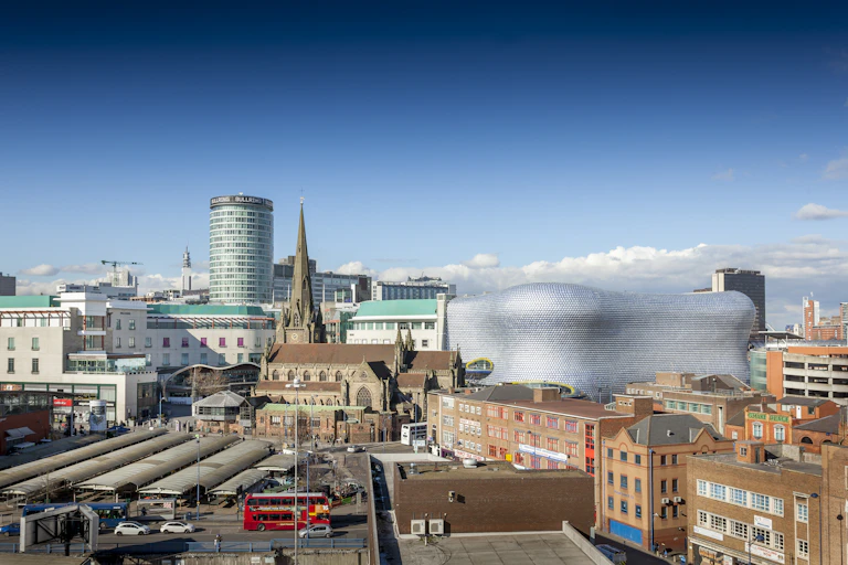View of the skyline of Birmingham, UK including The church of St Martin, the Bullring shopping centre and the outdoor market.