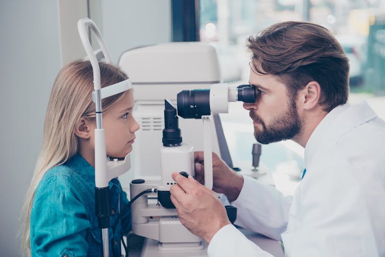 A girl gets her eyes tested.