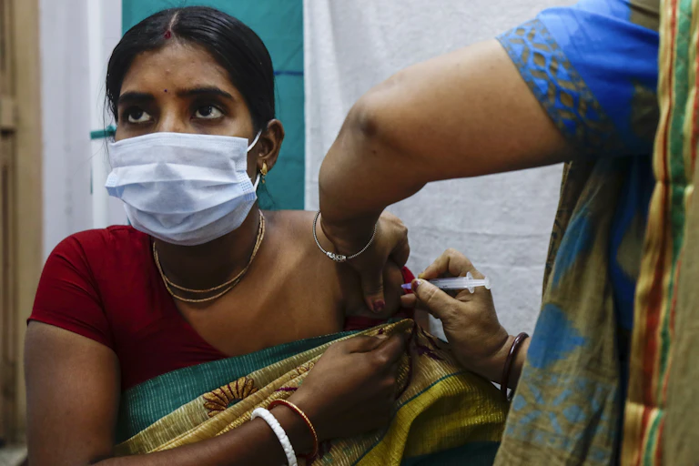 Indian woman getting vaccine.
