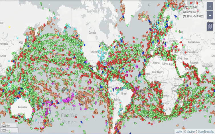 Shot of live map of shipping traffic, with cargo vessels in green.