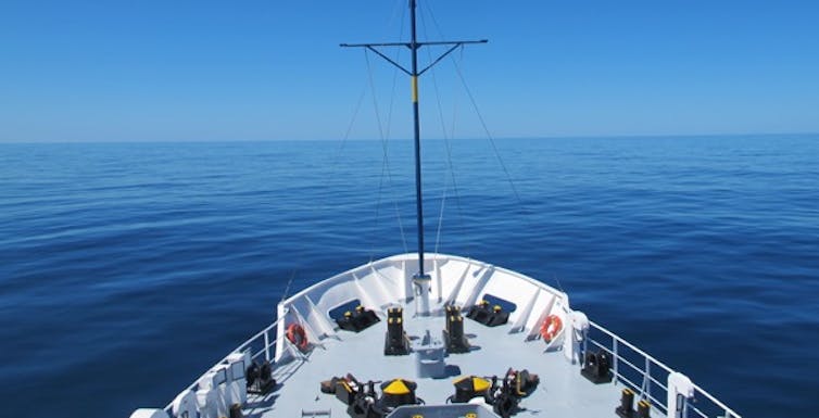 Ship heading into an open ocean.