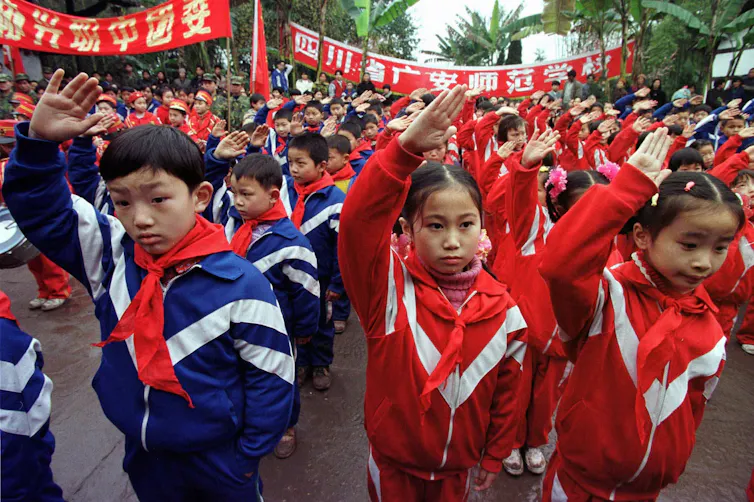 Young pioneers at a ceremony to commemorate the first anniversary of former leader Deng Xiaoping's death 1998.