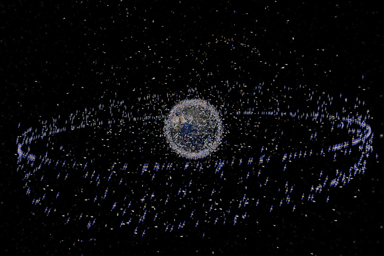 Artist's view of traceable debris around the Earth - the debris is shown magnified relative to the size of the Earth.