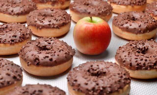 chocolate donuts and an apple