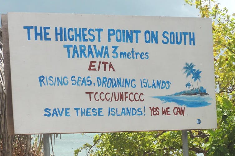 Sign saying that the highest point on Kiribati's main island is three metres above sea level