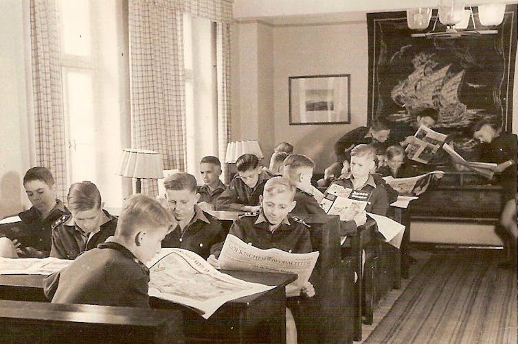 Young German schoolboys in the reading room of NPEA Rügen, 1943