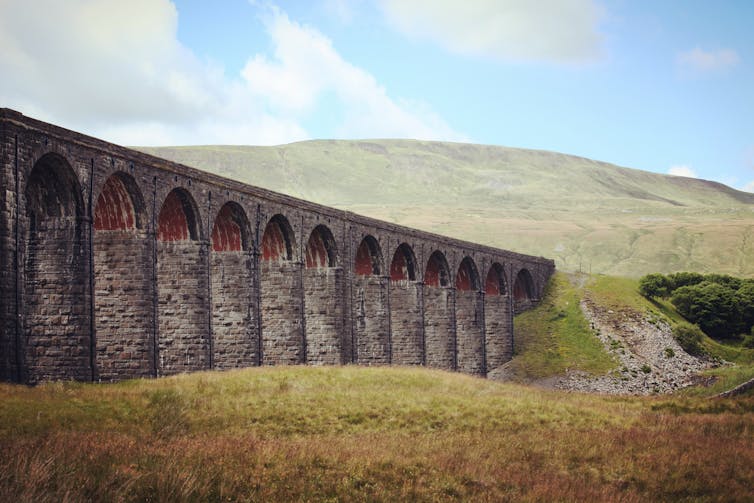 A view of the Ribblehead Viaduct and Whernside Peak, Ribblesdale in the Yorkshire Dales, North Yorkshire.