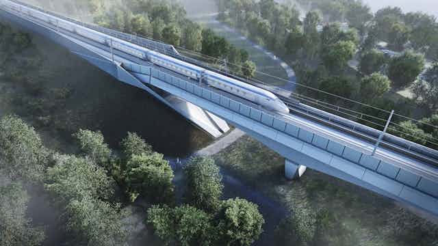 Computer generated image of high speed train travelling along a modern viaduct.