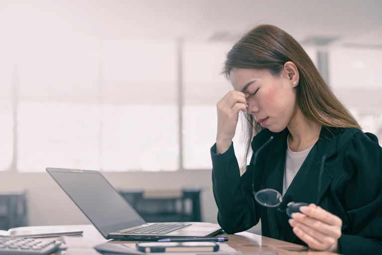Stressed woman at laptop