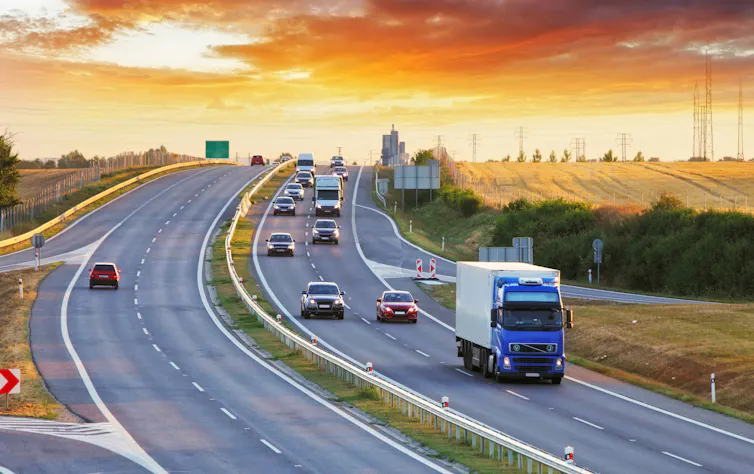 Trucks and cars on a major road.