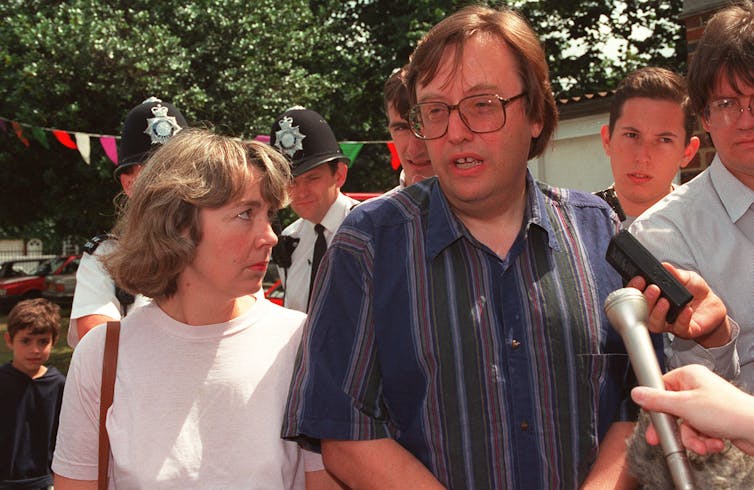 David Mellor and his wife attend a summer fair.