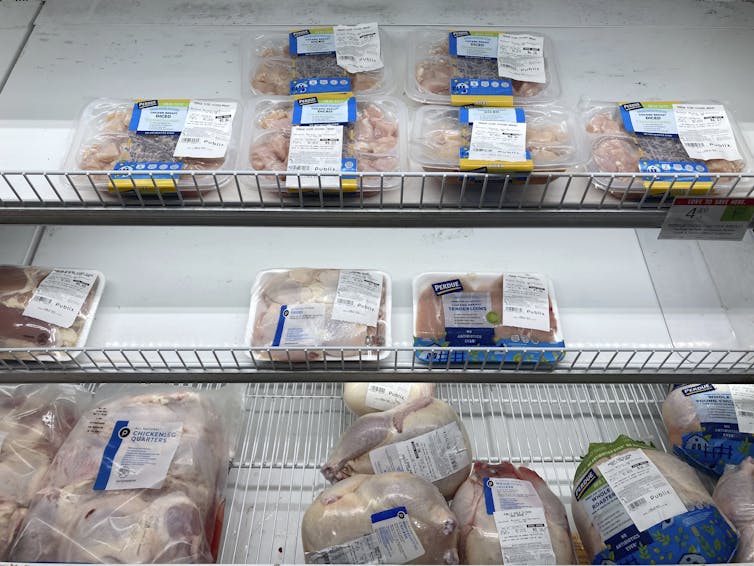 A nearly empty case of different chicken cuts is displayed at a Publix Supermarket in Miami.