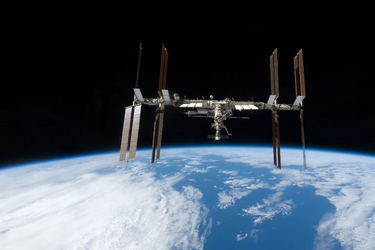 A space station with Earth and the horizon in the background.