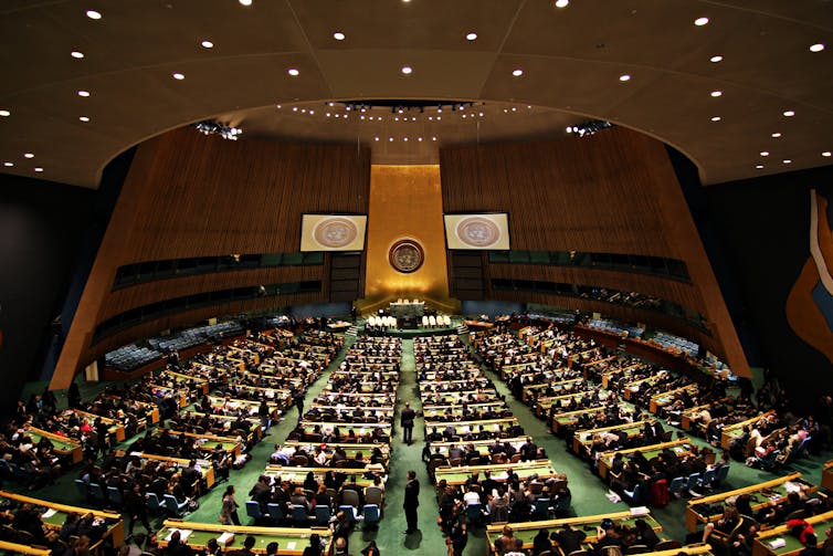 A large meeting hall in the United Nations headquarters filled with Outer Space Treaty delegates
