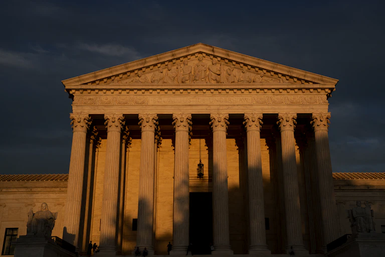 The front of the Supreme Court building, one-third in shadow.