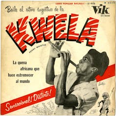 An album cover reading 'Kwela' and showing a young man playing a penny whistle.