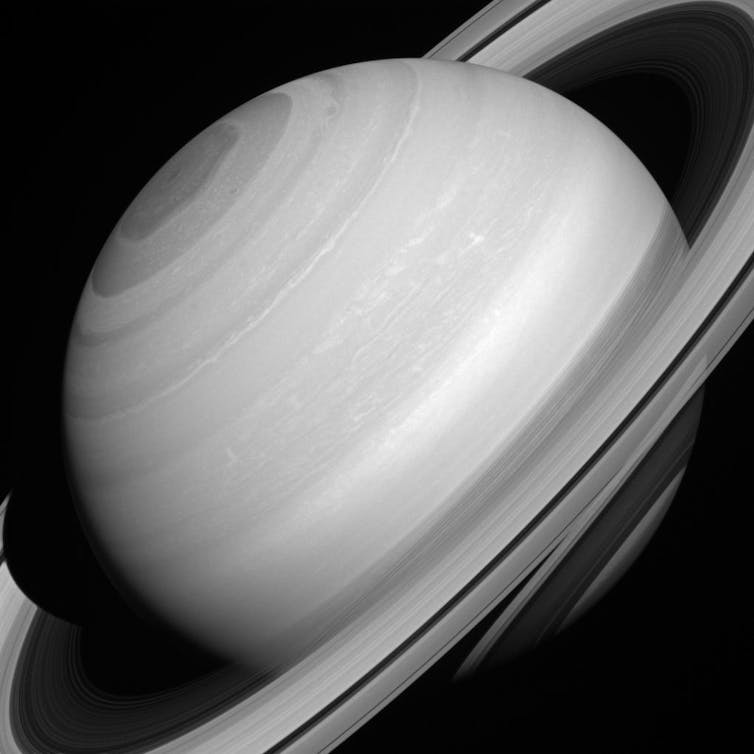 Black and white photograph of planet with rings
