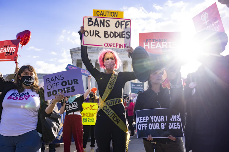 Women hold up 'bans off our bodies' signs outside US supreme court.