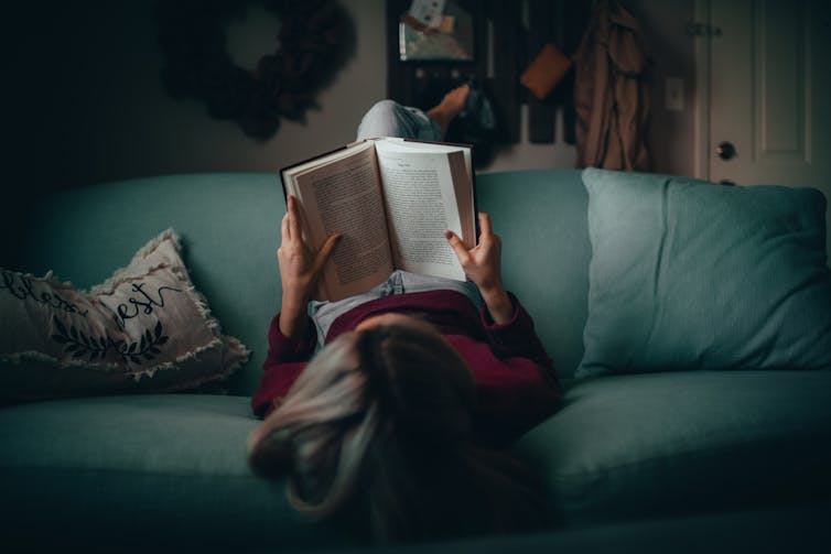 A woman reads a book