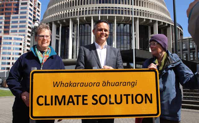 Climate chaneg minister James Shaw with protesters