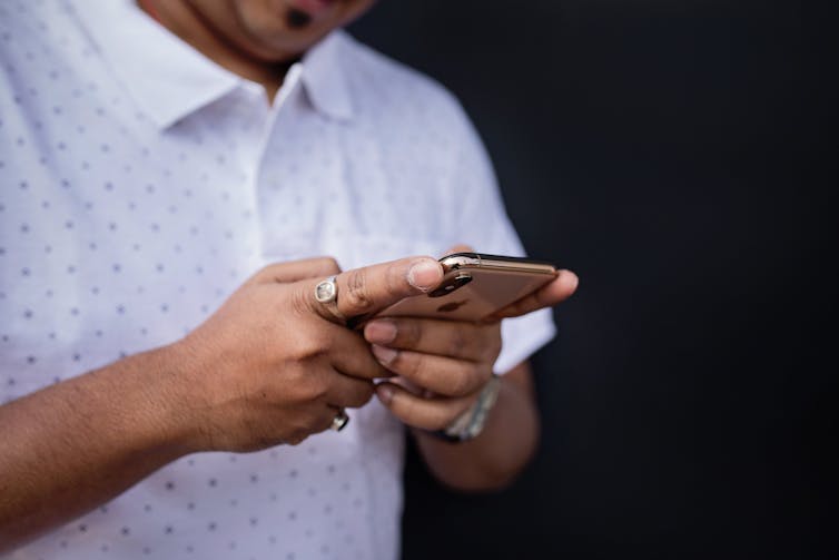A person looks at their phone