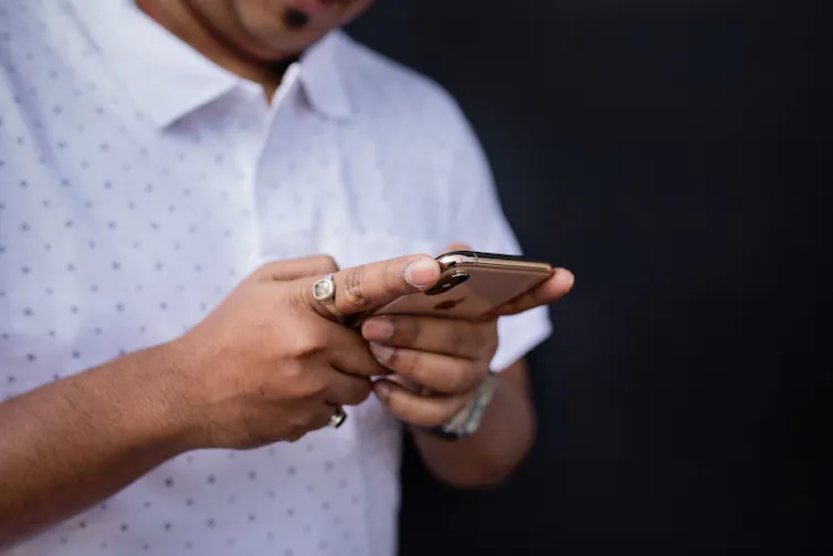 A person looks at their phone