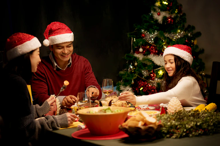 A family of three having Christmas dinner