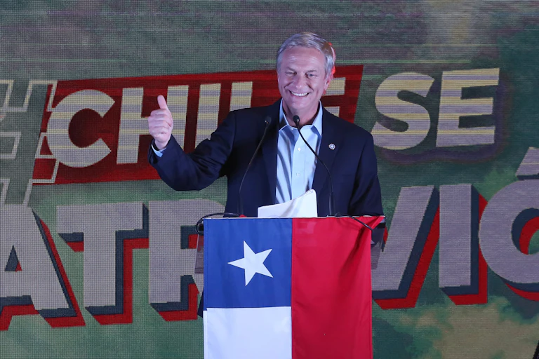 Chilean Republican Party candidate José Antonio Kast gives a thumbs up sign to supporters after hearing the result of the general election, November 21 2021.